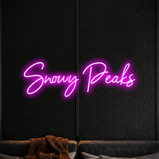 Pink script-style LED neon sign reading "Snowy Peaks" against a black textured wall