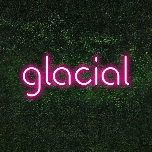 Hot pink LED neon sign reading "Glacial" against a textured green moss wall