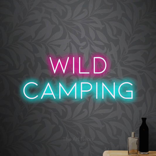 Ice blue and hot pink LED neon sign reading "Wild Camping" against light grey floral wallpaper