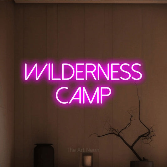 Pink LED neon sign reading "Wilderness Camp" against a warm brown wall