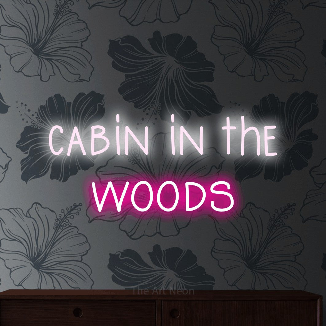 Hot pink and cool white LED neon sign reading "Cabin in the Woods" against grey floral wallpaper
