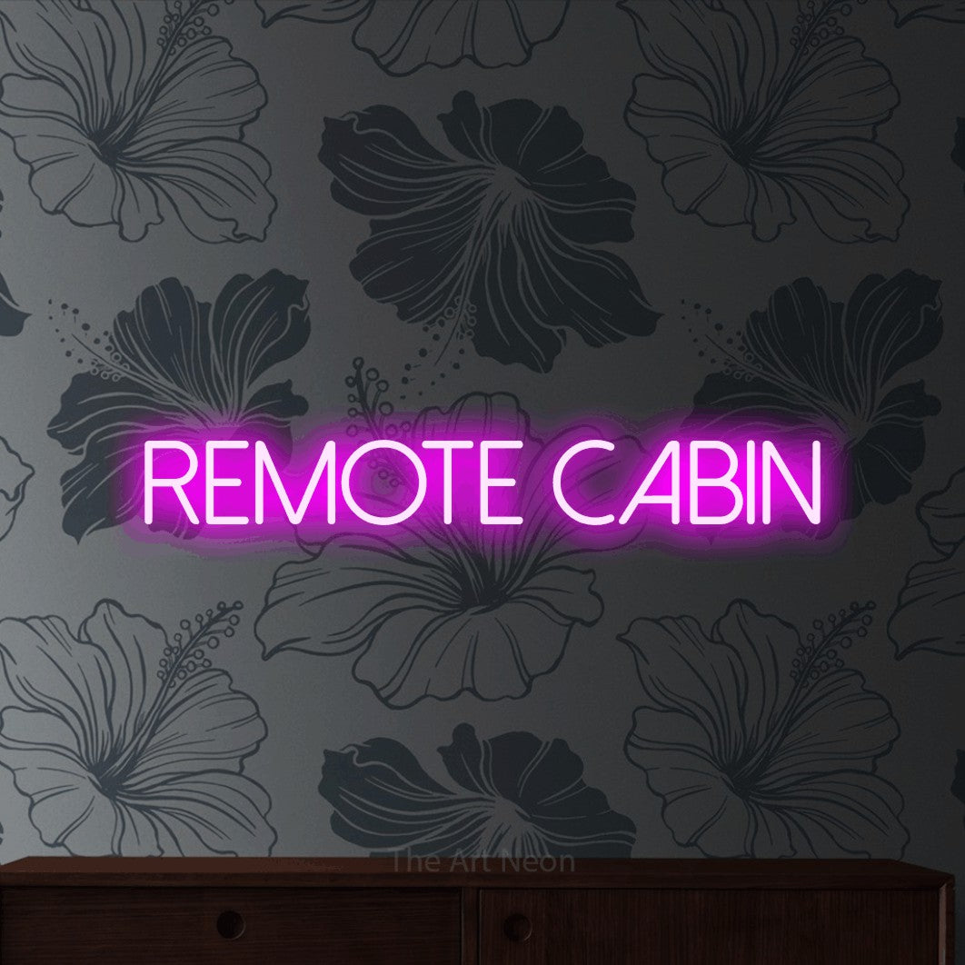 Pink LED neon sign reading "Remote Cabin" against grey floral wallpaper