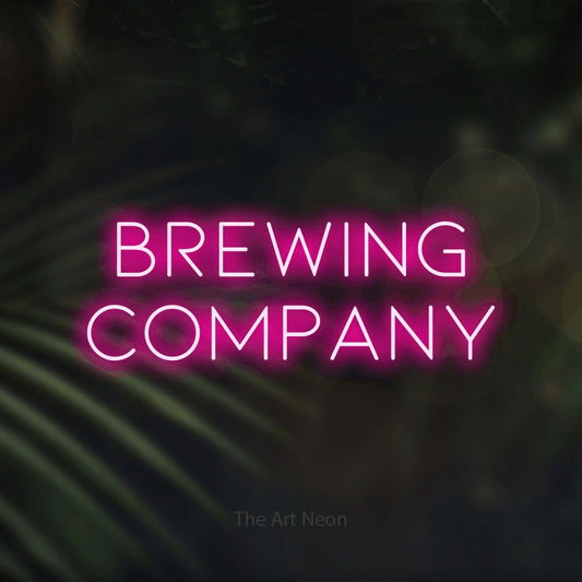 Hot pink LED neon sign reading "Brewing Company" against dark blurred palm leaves