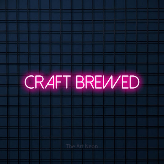 Hot pink LED neon sign reading "Craft Brewed" against a dark blue tiled wall