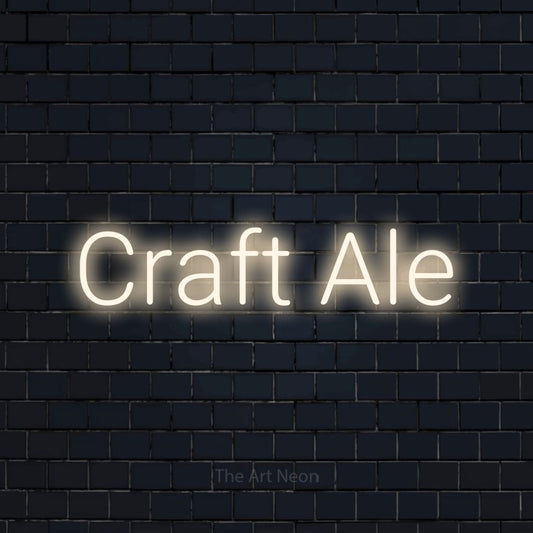 Warm white LED neon sign reading "Craft Ale" against a dark navy brick wall