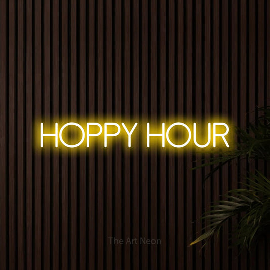 Yellow LED neon sign reading "Hoppy Hour" against dark wooden slats