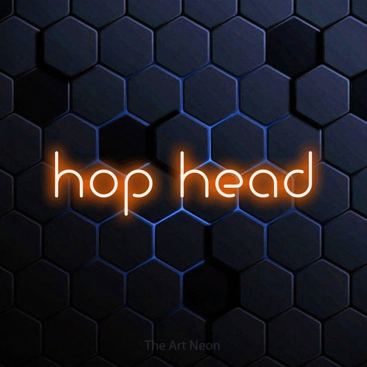 Orange LED neon sign reading "Hop Head" against a blue hexagonal wall