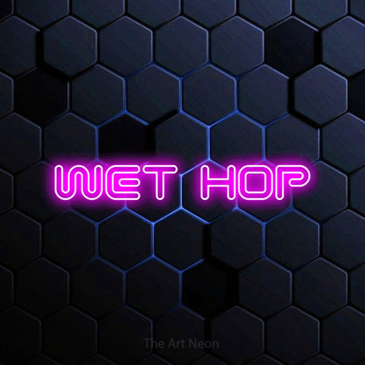 Pink outline-style LED neon sign reading "Wet Hop" against a blue hexagonal wall