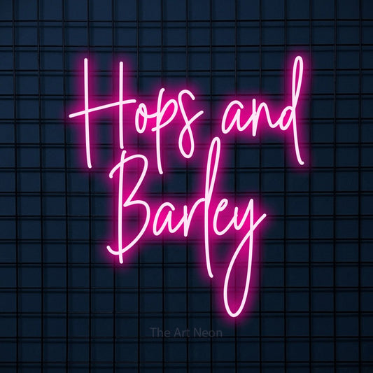 Hot pink script-style LED neon sign reading "Hops and Barley" against a dark blue tiled wall