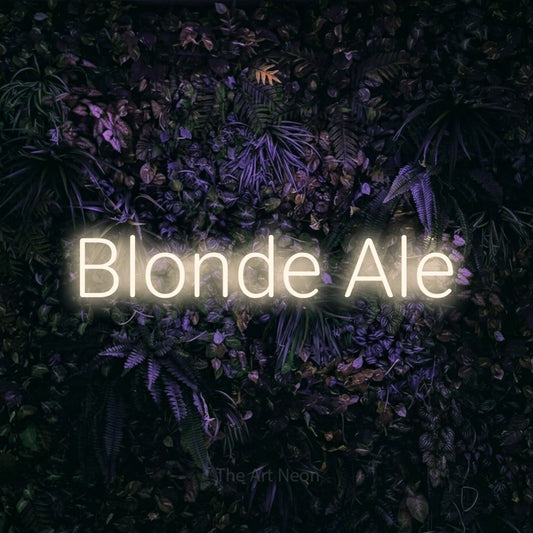 Warm white LED neon sign reading "Blonde Ale" against a purple floral wall