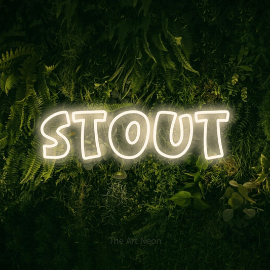 Warm white outline-style LED neon sign reading "Stout" against a moss-covered green wall