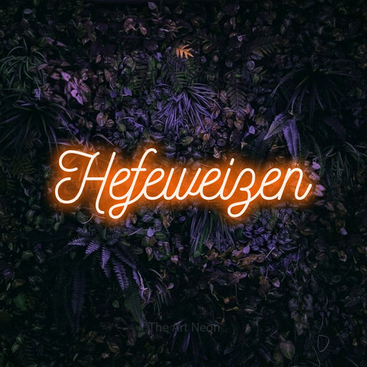 Orange script-style LED neon sign reading "Hefeweizen" against a purple floral wall