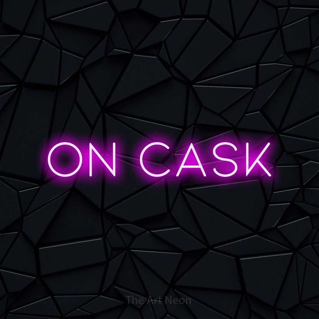 Pink LED neon sign reading "On Cask" against a black faceted wall