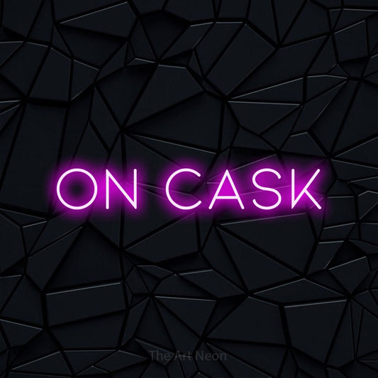 Pink LED neon sign reading "On Cask" against a black faceted wall