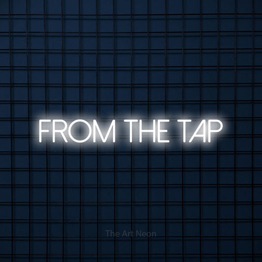 Cool white LED neon sign reading "From the Tap" against a dark blue tiled wall