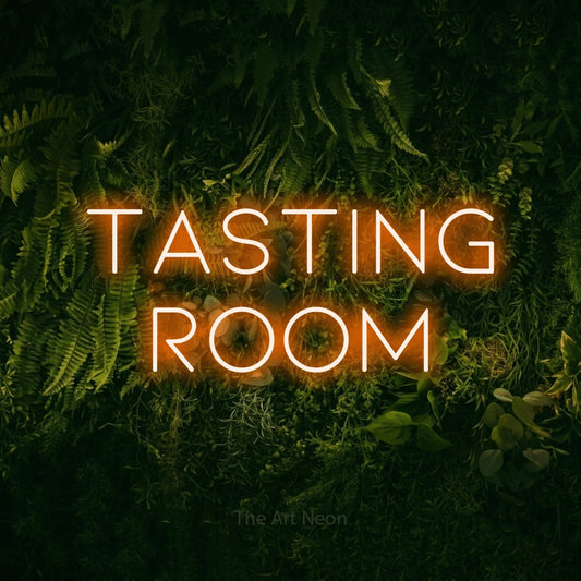 Orange LED neon sign reading "Tasting Room" against a moss-covered green wall