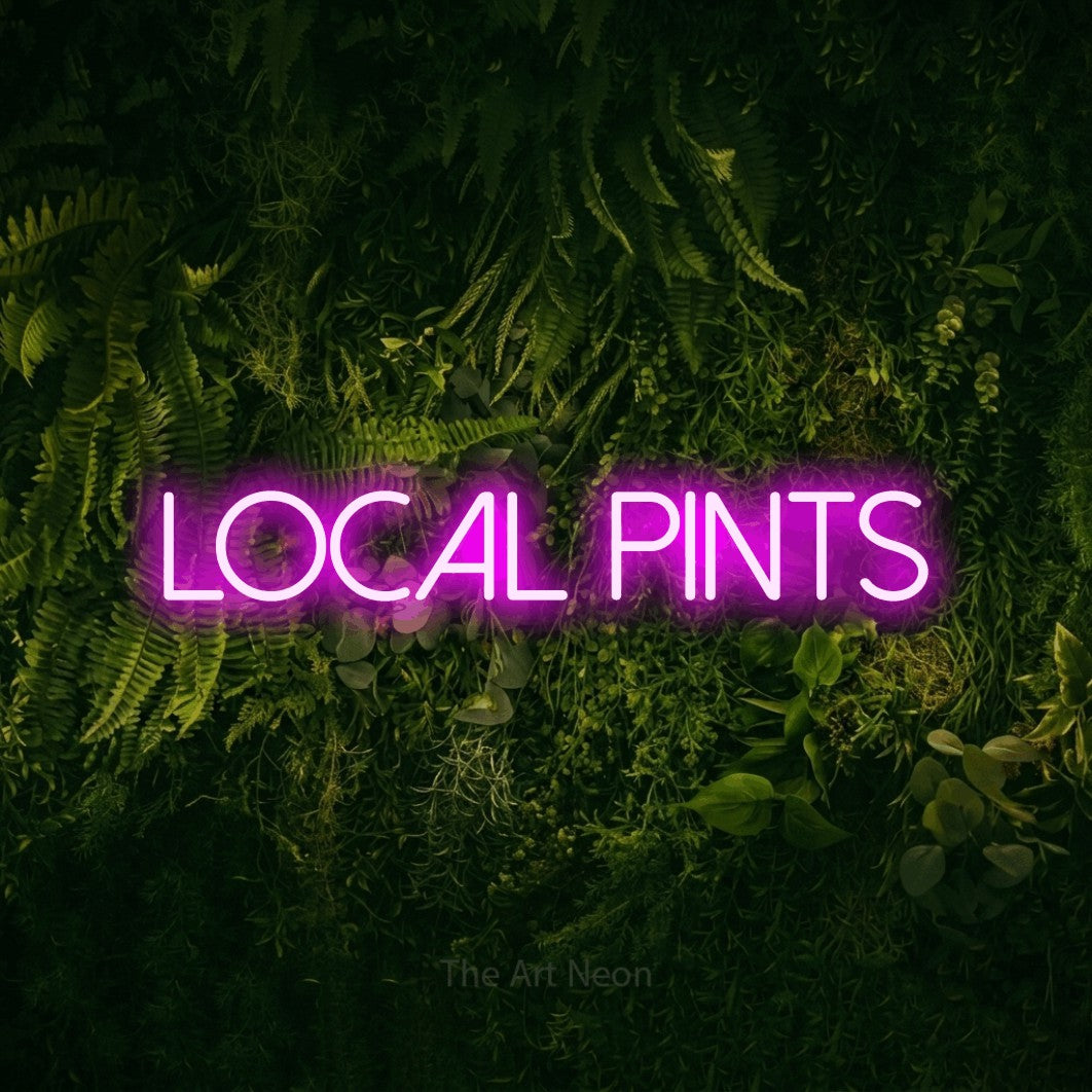 Pink LED neon sign reading "Local Pints" against a moss-covered green wall