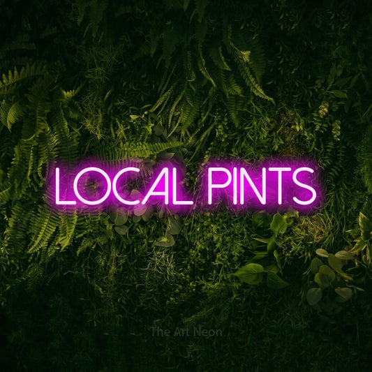 Pink LED neon sign reading "Local Pints" against a moss-covered green wall