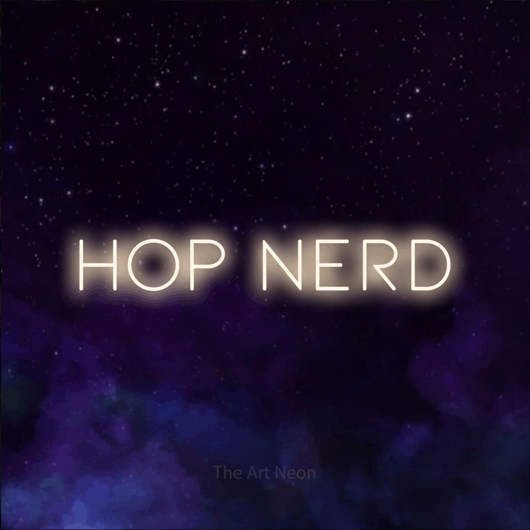 Warm white LED neon sign reading "Hop Nerd" against a purple galaxy background