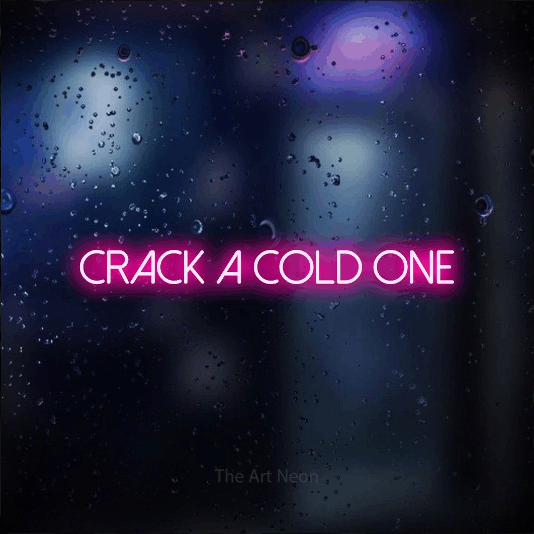 Hot pink LED neon sign reading "Crack a Cold One" against a dark blue bokeh background