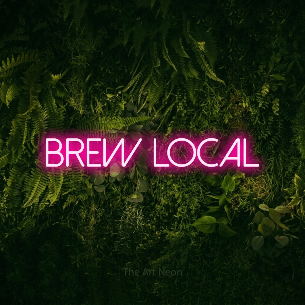 Hot pink LED neon sign reading "Brew Local" against a moss-covered green wall