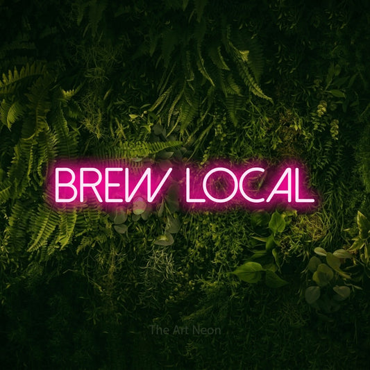 Hot pink LED neon sign reading "Brew Local" against a moss-covered green wall