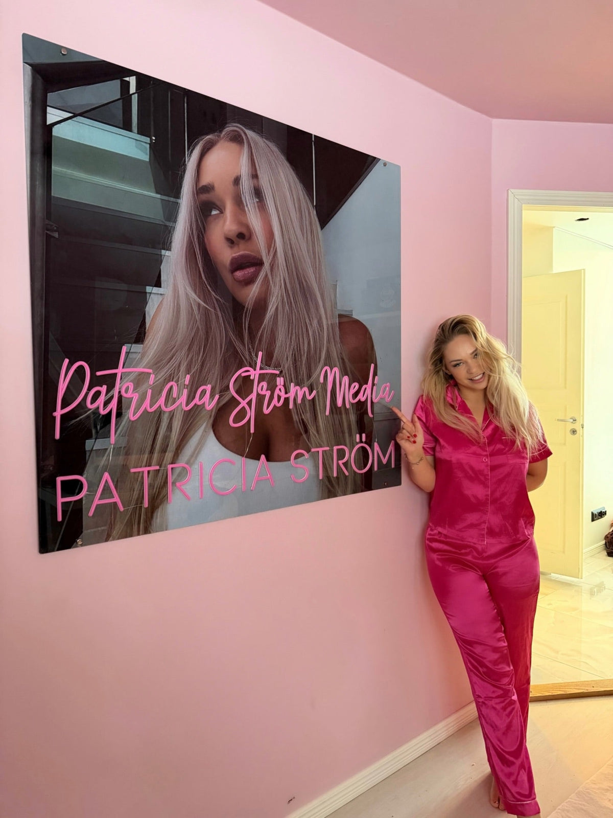Patricia Ström Media custom logo LED neon sign installed indoors