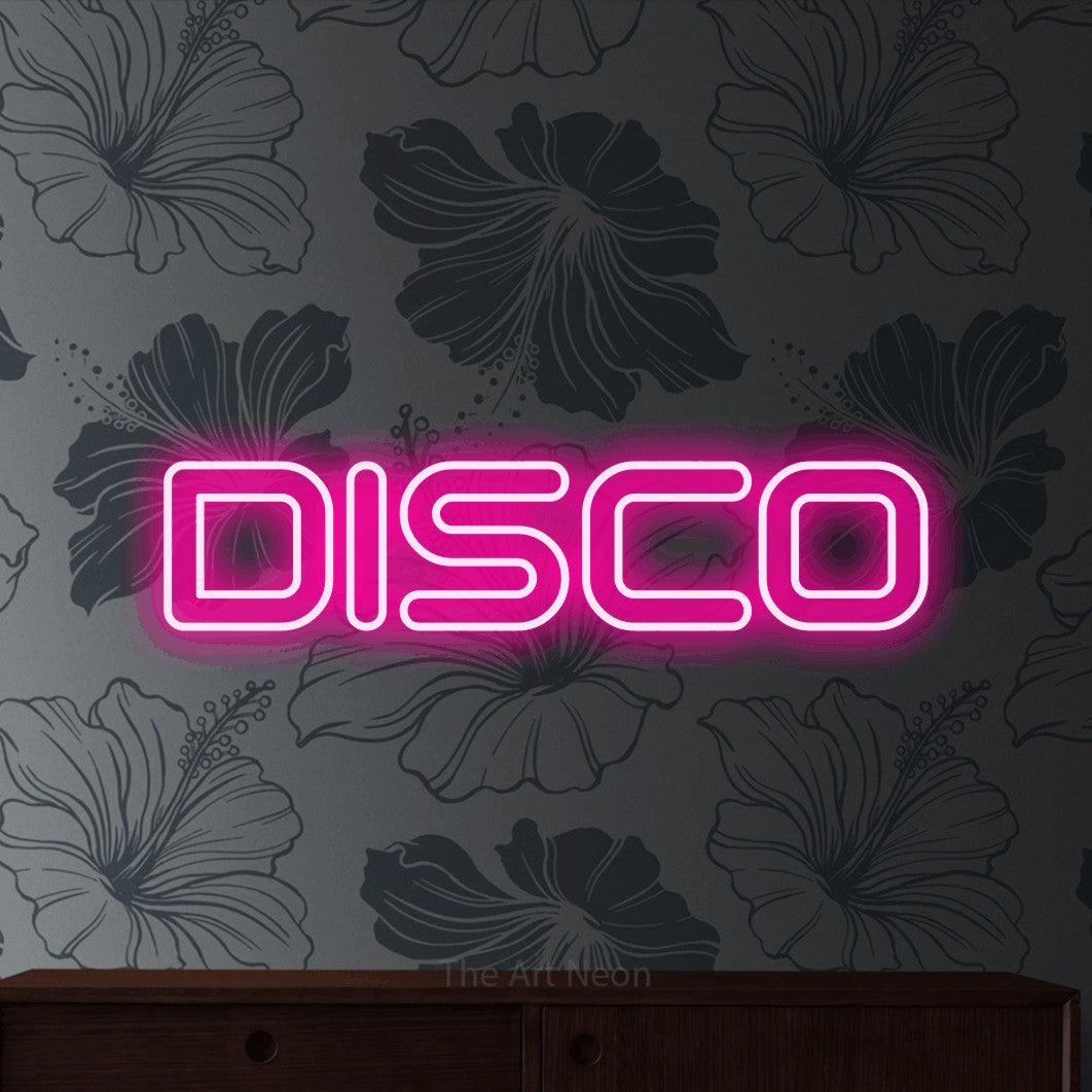 “Disco” LED neon sign in hot pink, with futuristic double-line lettering, shown against a grey floral-patterned wall.
