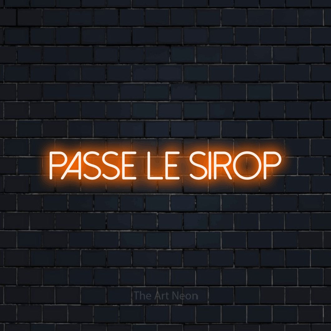 “Passe le sirop” LED neon sign in orange, with thin sans-serif lettering, shown against a dark navy brick wall.