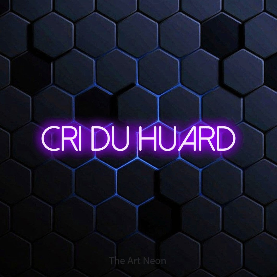 “Cri du huard” LED neon sign in purple, with thin sans-serif lettering, shown against a dark blue honeycomb pattern.