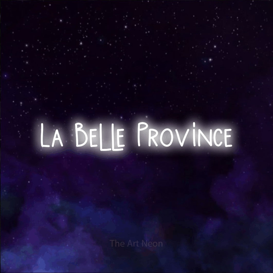 “La belle province” LED neon sign in cool white, with narrow hand-drawn lettering, shown against a purple galaxy backdrop.