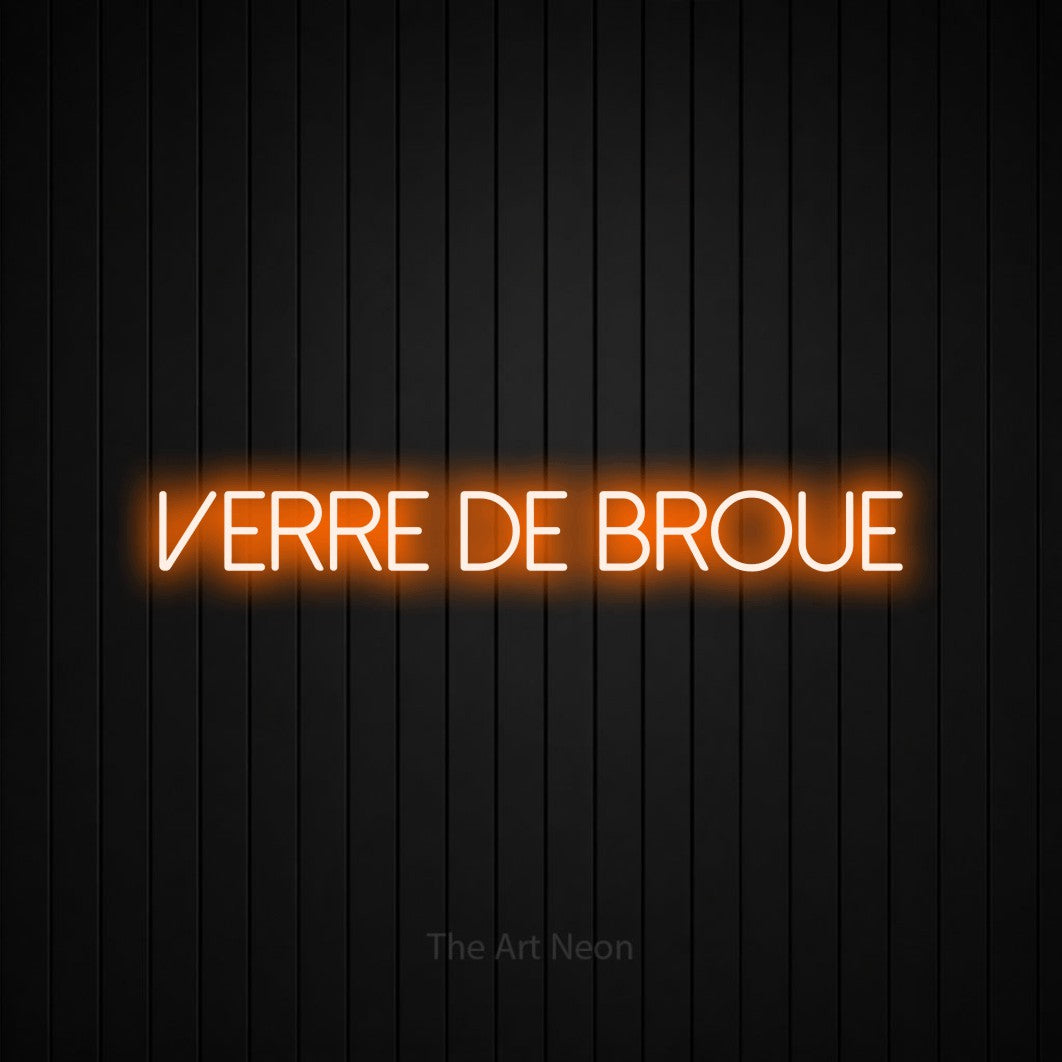 “Verre de broue” LED neon sign in orange, with thin sans-serif lettering, shown against black vertical wall slats.