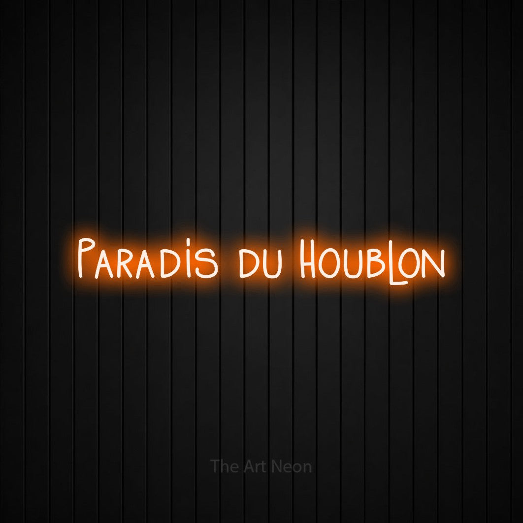 “Paradis du houblon” LED neon sign in orange, with narrow hand-drawn lettering, shown against black vertical wall slats.