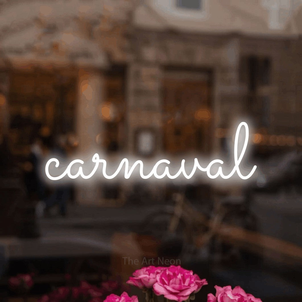 “Carnaval” LED neon sign in cool white, with looped cursive lettering, shown against a blurred café-bar interior.