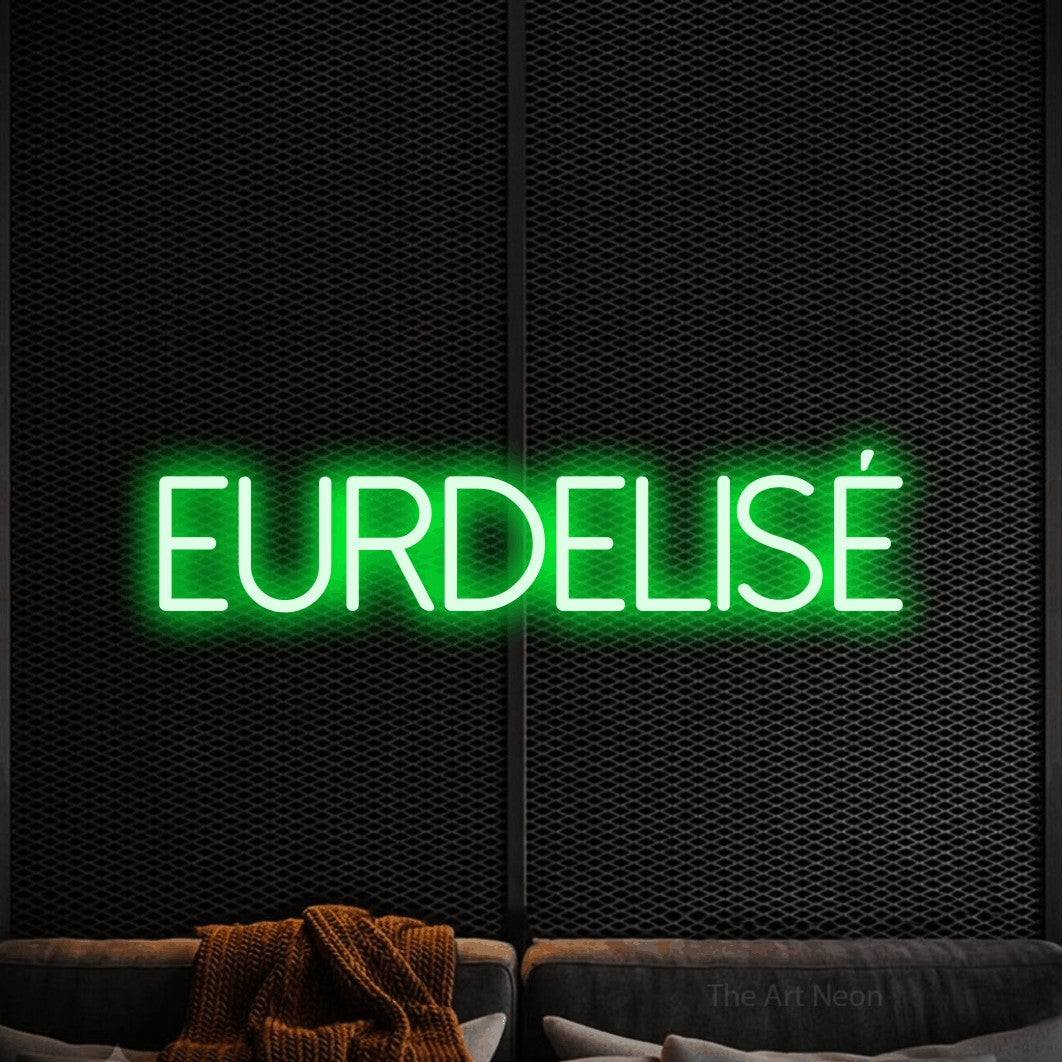 “Fleurdelisé” LED neon sign in green, with thin sans-serif lettering, shown against a modern dark-toned seating area.
