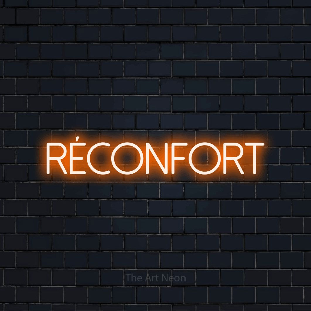 “Réconfort” LED neon sign in orange, with thin sans-serif lettering, shown against a dark navy brick wall.