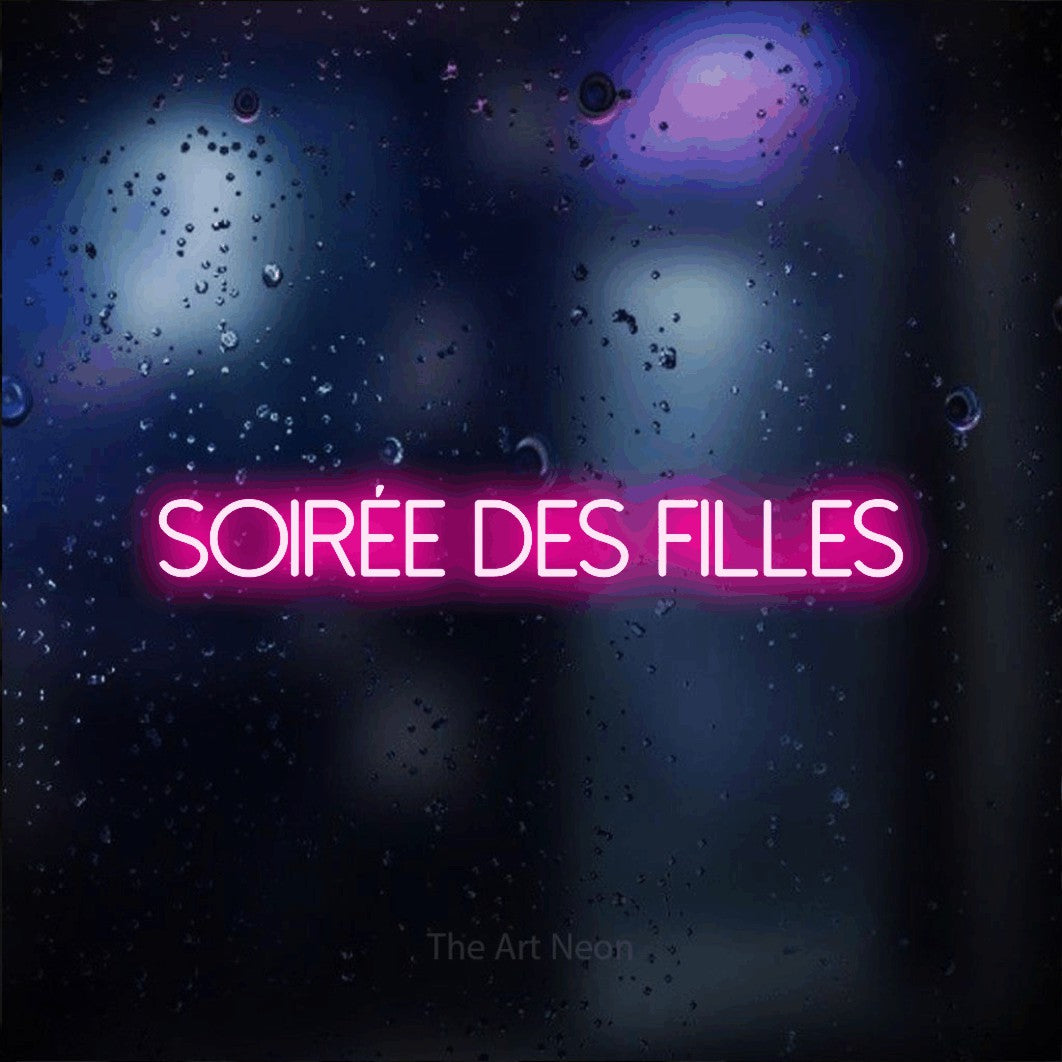 Néon LED « Soirée des filles » en rose vif, en lettres fines sans empattement, mis en scène sur une vitre aux reflets bleus et violets, pour une fête.