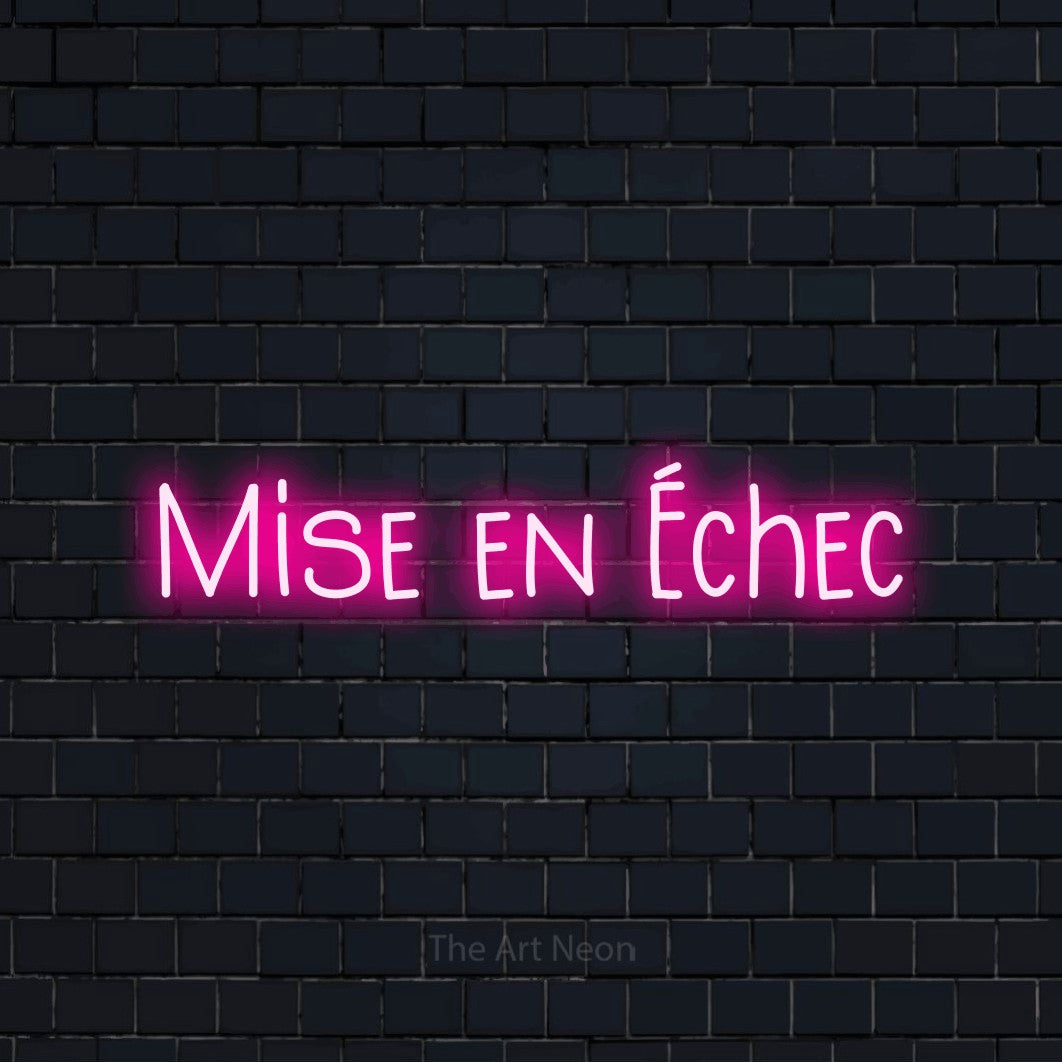 “Mise en échec” LED neon sign in hot pink, with narrow hand-drawn lettering, shown against a dark navy brick wall.