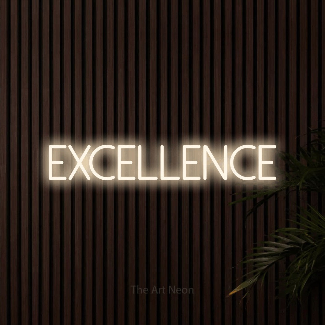 “Excellence” LED neon sign in warm white, with thin sans-serif lettering, shown against dark wooden wall slats.