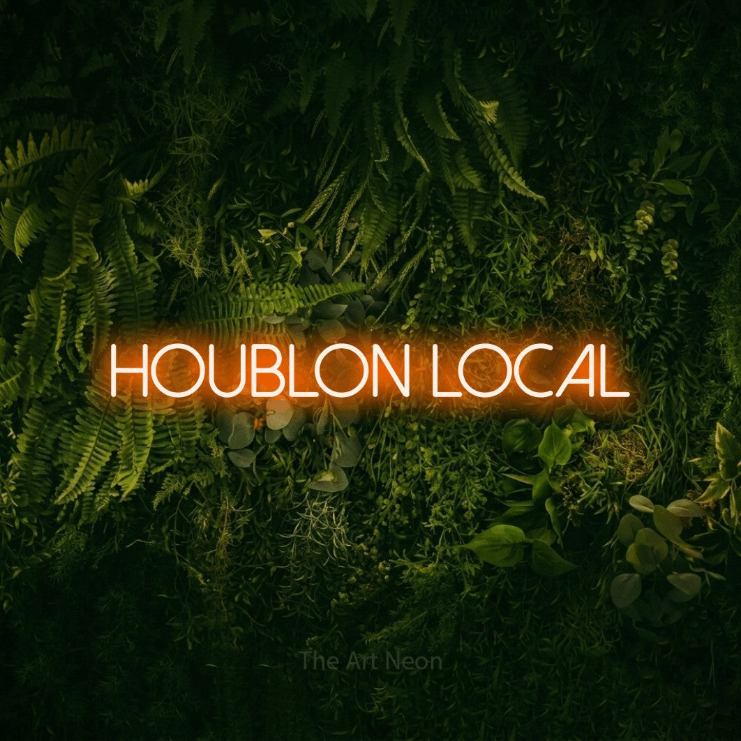 “Houblon local” LED neon sign in orange, with thin sans-serif lettering, shown against a dark moss and forest backdrop.