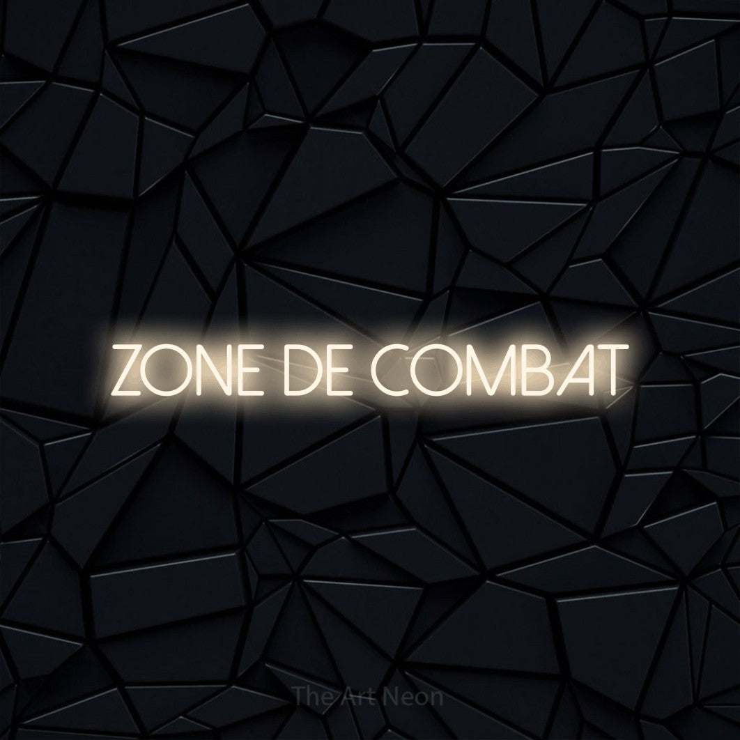 “Zone de combat” LED neon sign in warm white, with thin sans-serif lettering, shown against a black polygonal surface.