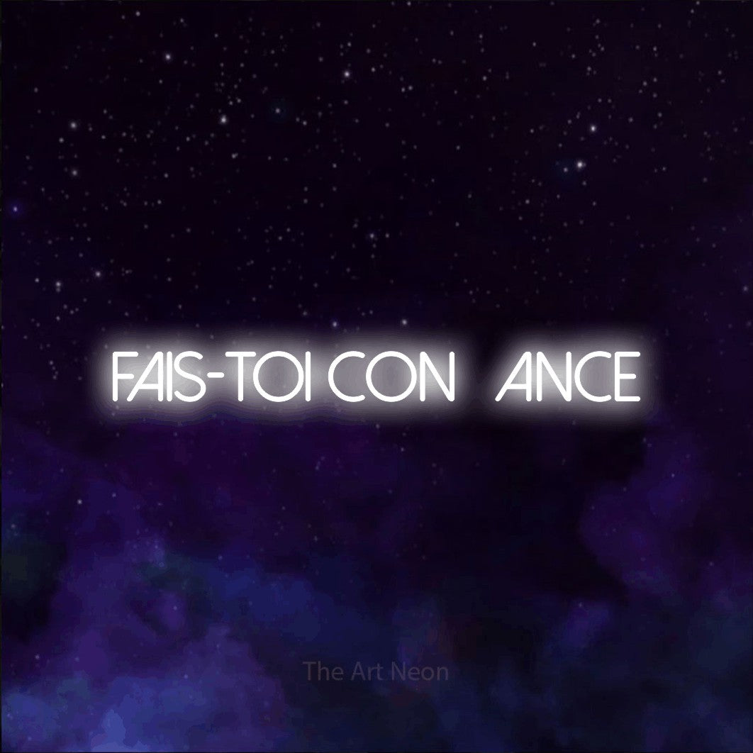 “Fais-toi confiance” LED neon sign in cool white, with thin sans-serif lettering, shown against a purple galaxy backdrop.