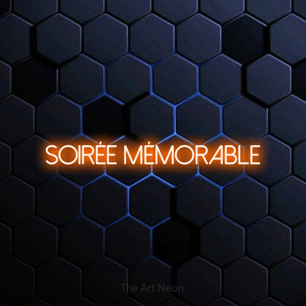 “Soirée mémorable” LED neon sign in orange, with thin sans-serif lettering, shown against a dark blue honeycomb pattern.
