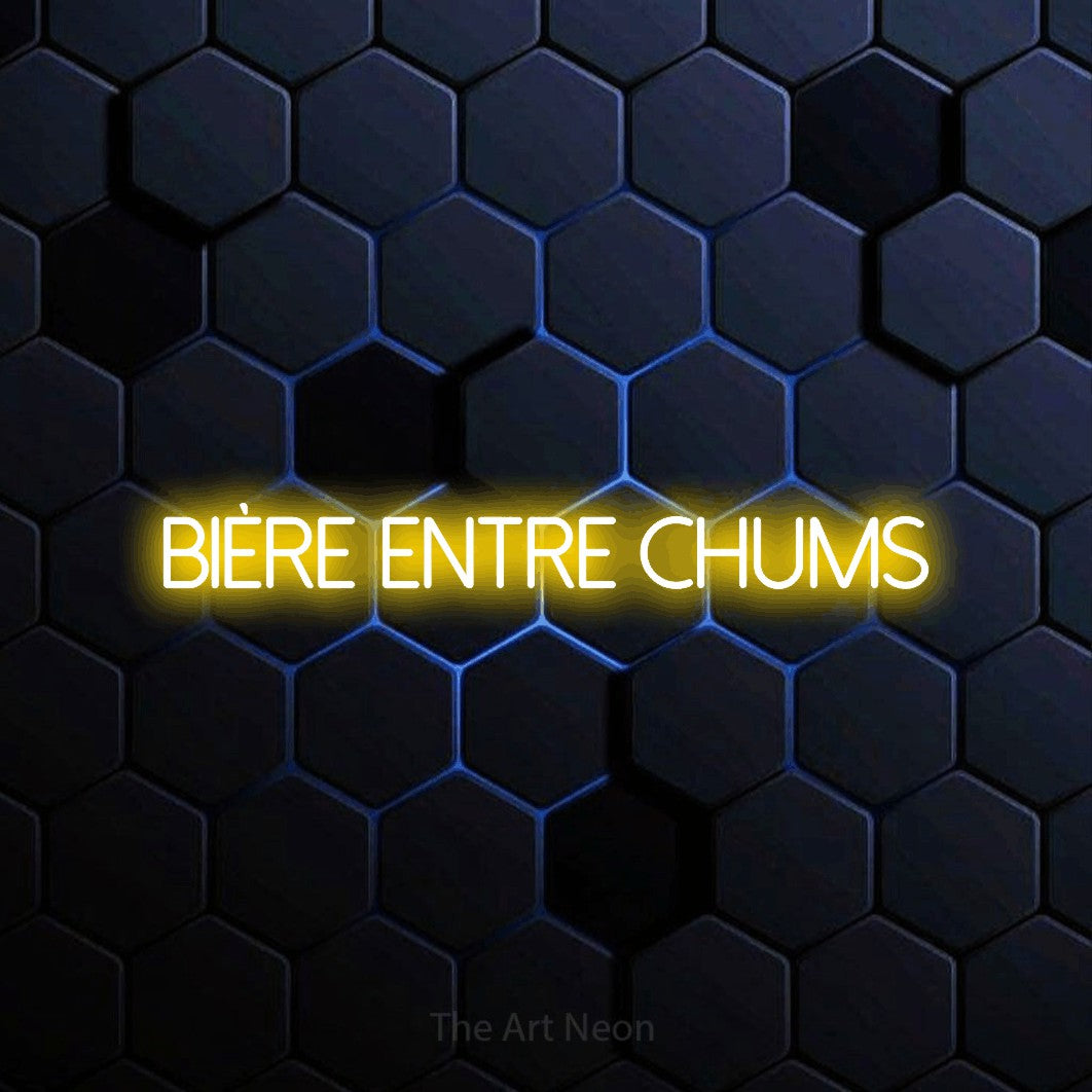 “Bière entre chums” LED neon sign in yellow, with thin sans-serif lettering, shown against a dark blue honeycomb pattern.