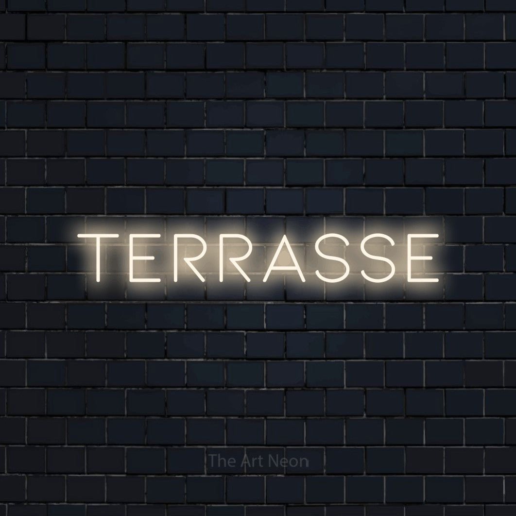 “Terrasse” LED neon sign in warm white, with thin, widely spaced lettering, shown against a dark navy brick wall.