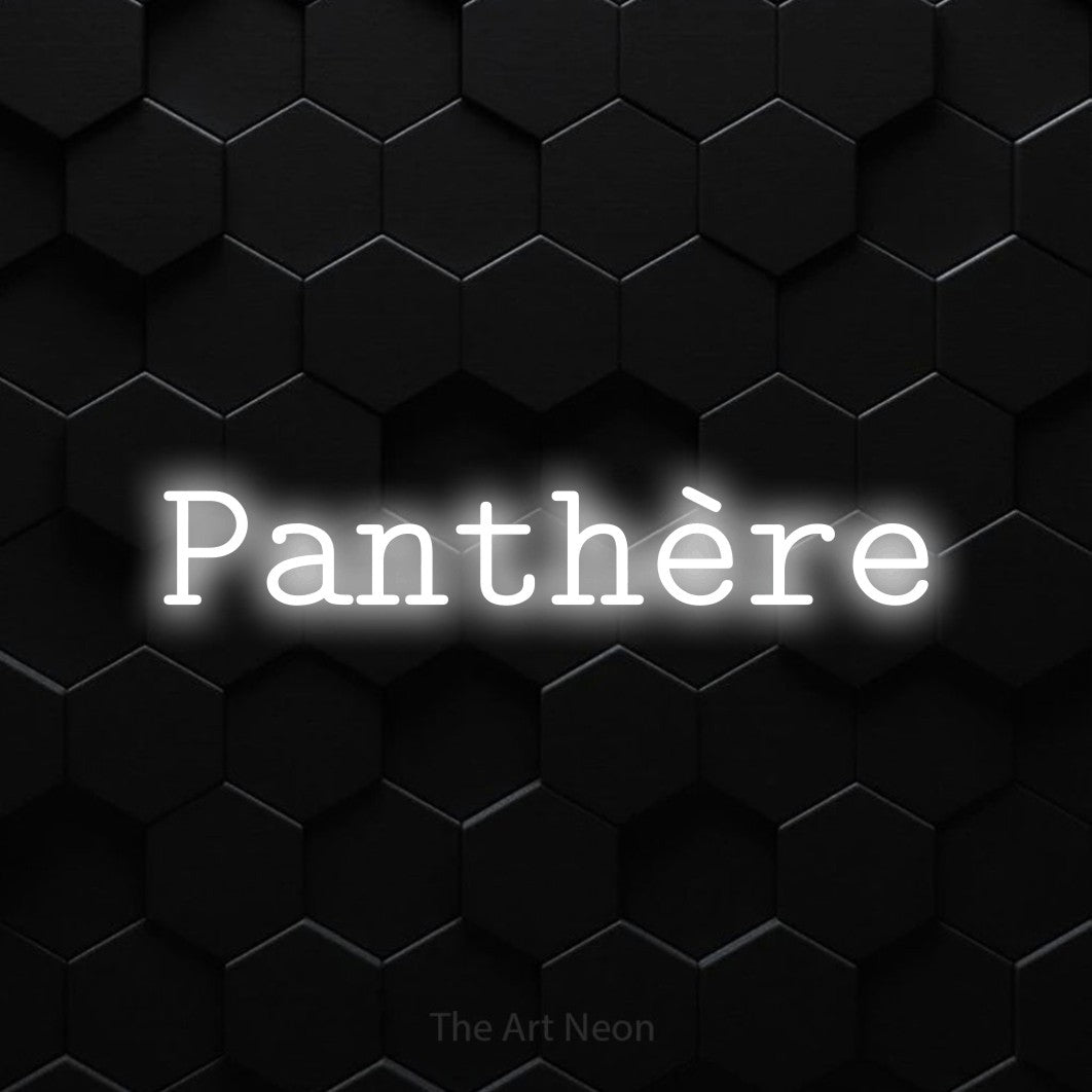 “Panthère” LED neon sign in cool white, with typewriter-style lettering, shown against black hexagonal wall tiles.