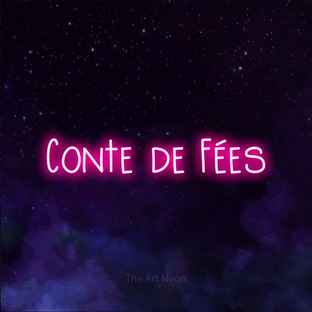 “Conte de fées” LED neon sign in hot pink, with narrow hand-drawn lettering, shown against a purple galaxy backdrop.