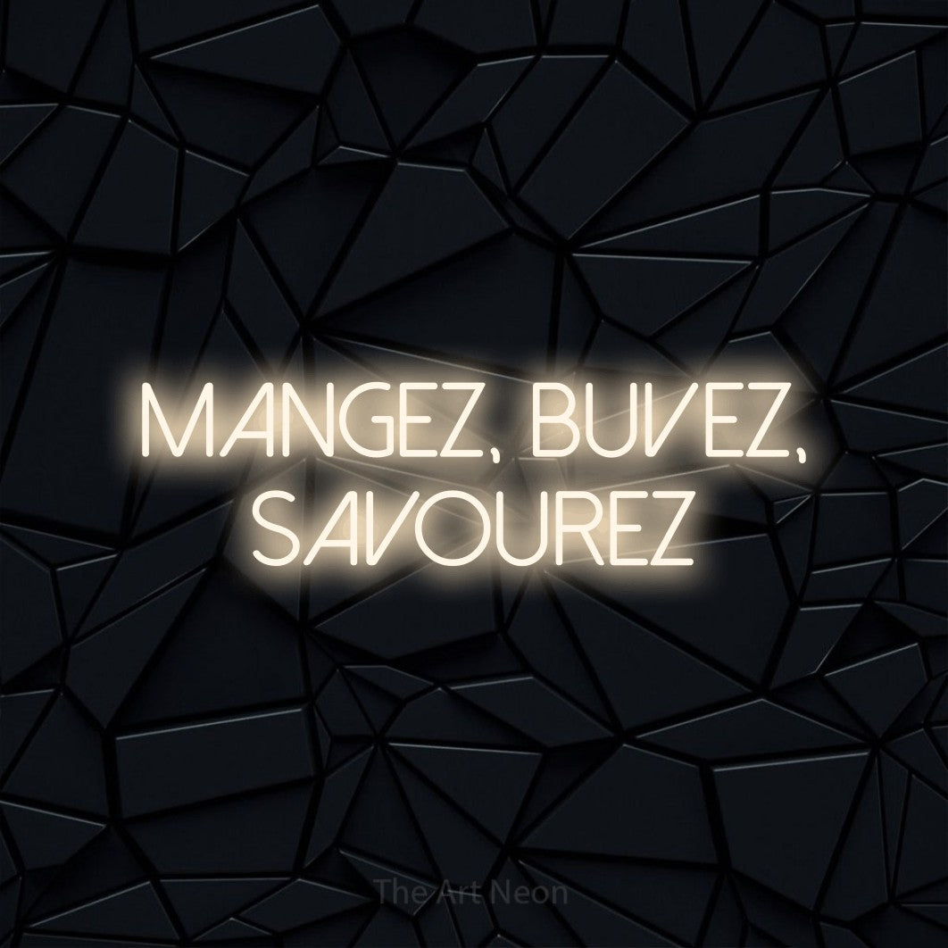 “Mangez, buvez, savourez” LED neon sign in warm white, with thin sans-serif lettering across 2 lines, shown against a black polygonal surface.