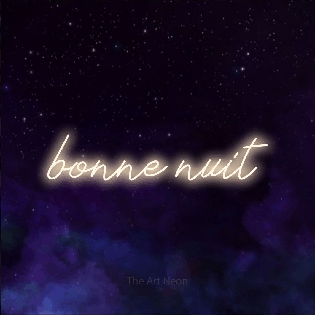 “Bonne nuit” LED neon sign in warm white, with cursive lettering, shown against a purple galaxy backdrop.
