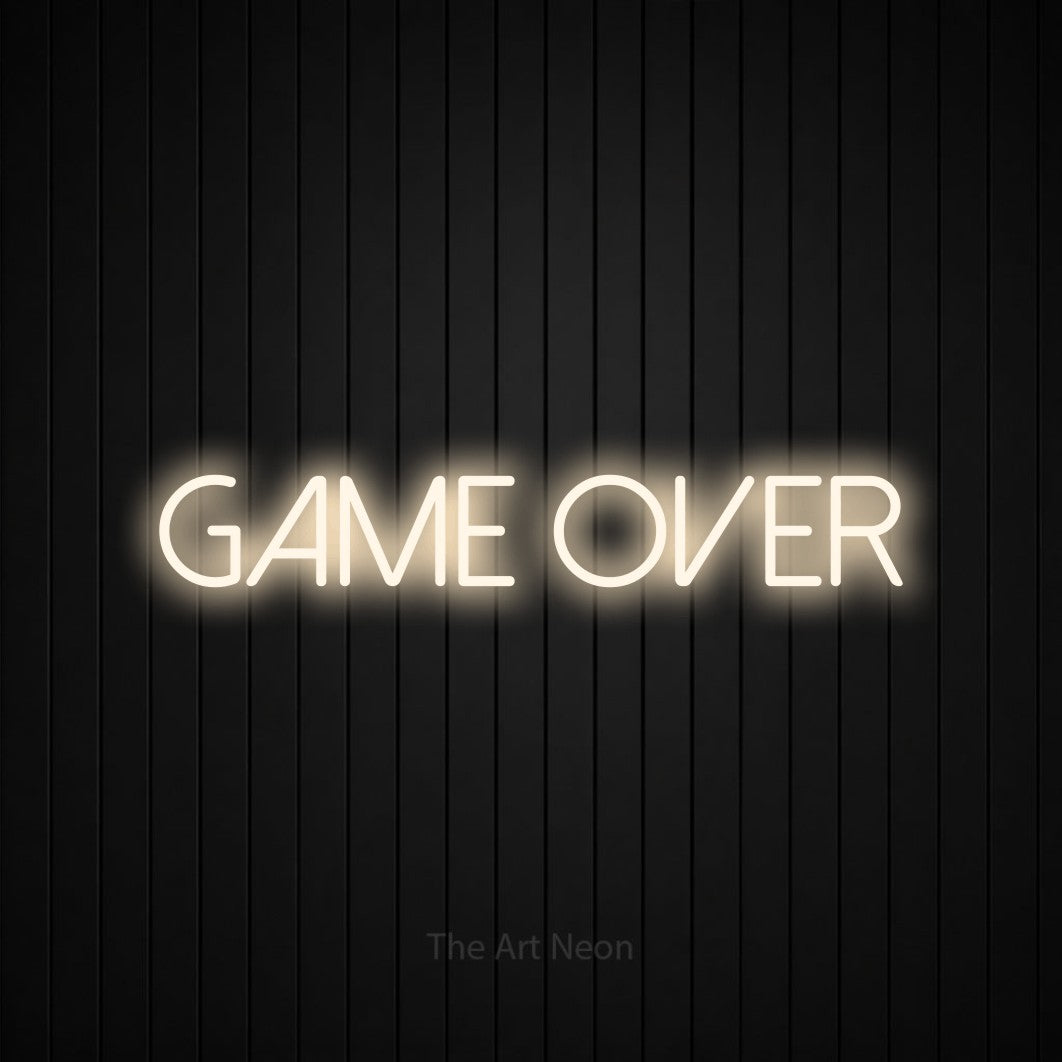 “Game over” LED neon sign in warm white, with thin sans-serif lettering, shown against black vertical wall slats.